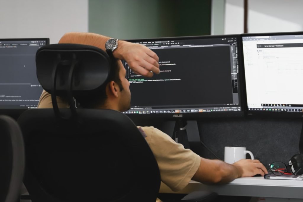 Mastering the First Impression: Your intriguing post title goes here a-man-sitting-in-front-of-two-computer-monitors-xn3d8dizh7q