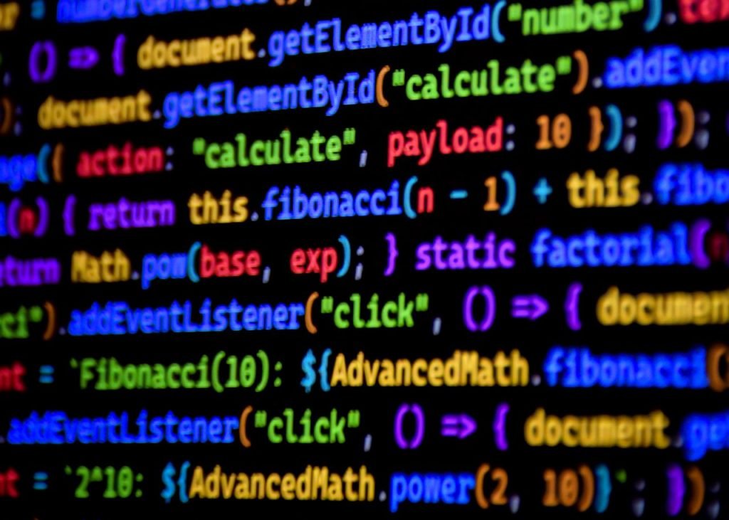 The Art of Drawing Readers In: Your attractive post title goes here Bright and colorful JavaScript code displayed on a computer screen, showcasing programming.